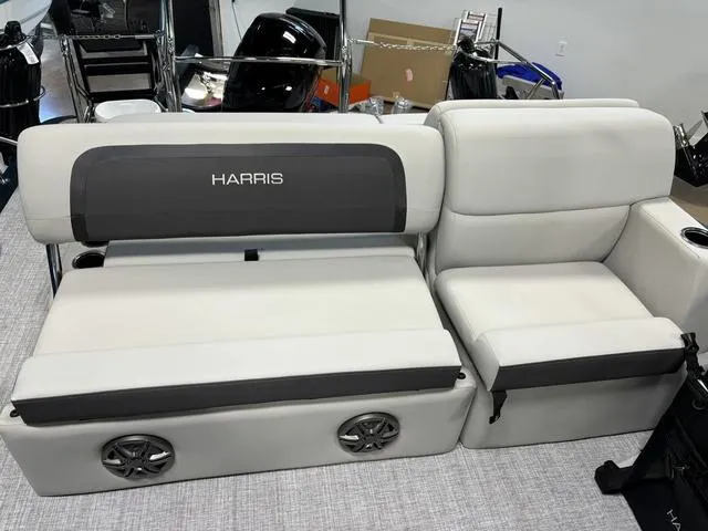 Slide: The Image of 2025 Harris CRUISER 230 SLDH boat seating with integrated speakers and cup holders. - 16