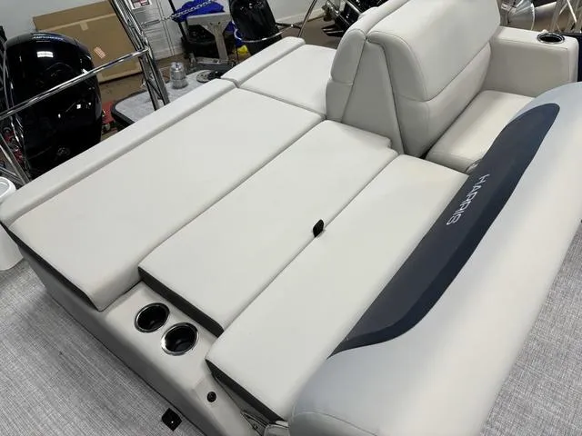 Slide: The Image of 2025 Harris CRUISER 230 SLDH boat interior with plush seating and cup holders. - 17