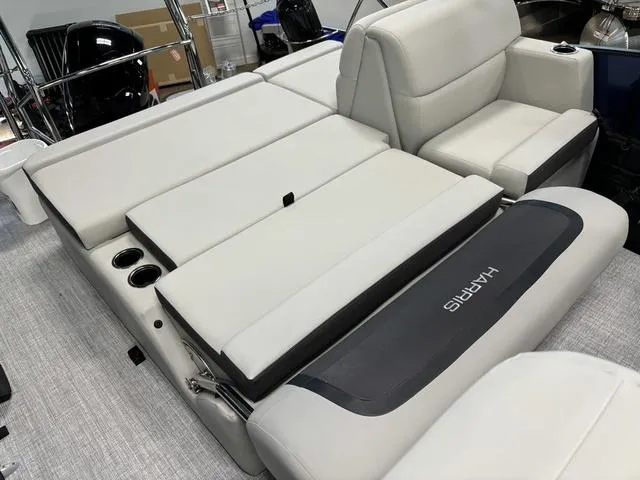Slide: The Image of 2025 Harris CRUISER 230 SLDH boat interior with plush seating and modern design. - 18