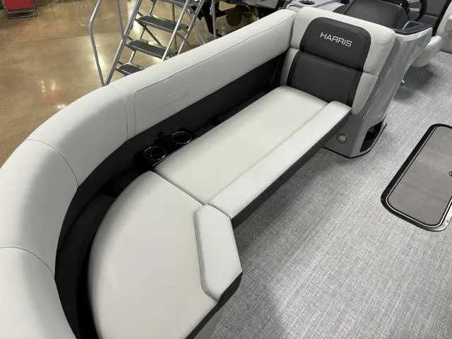 Slide: The Image of 2025 Harris CRUISER 230 SLDH boat interior with sleek, modern seating design. - 5