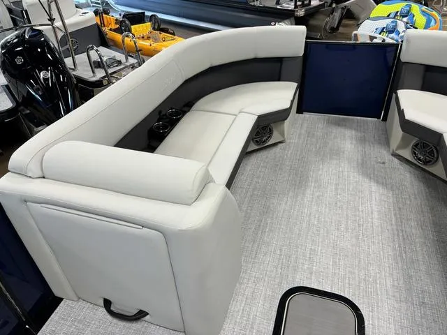 Slide: The Image of 2025 Harris CRUISER 230 SLDH boat interior with gray seating and modern design. - 8