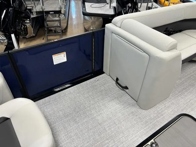 Slide: The Image of Interior of 2025 Harris CRUISER 230 SLDH boat with gray seating and flooring. - 9