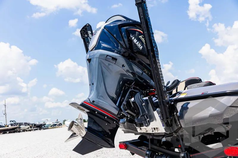 Slide: The Image of 2025 Skeeter ZXR 21 boat with Yamaha outboard motor, parked on gravel under blue sky. - 15