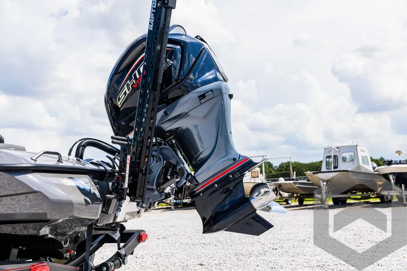 Slide: The Image of 2025 Skeeter ZXR 21 boat engine displayed outdoors on a sunny day. - 16