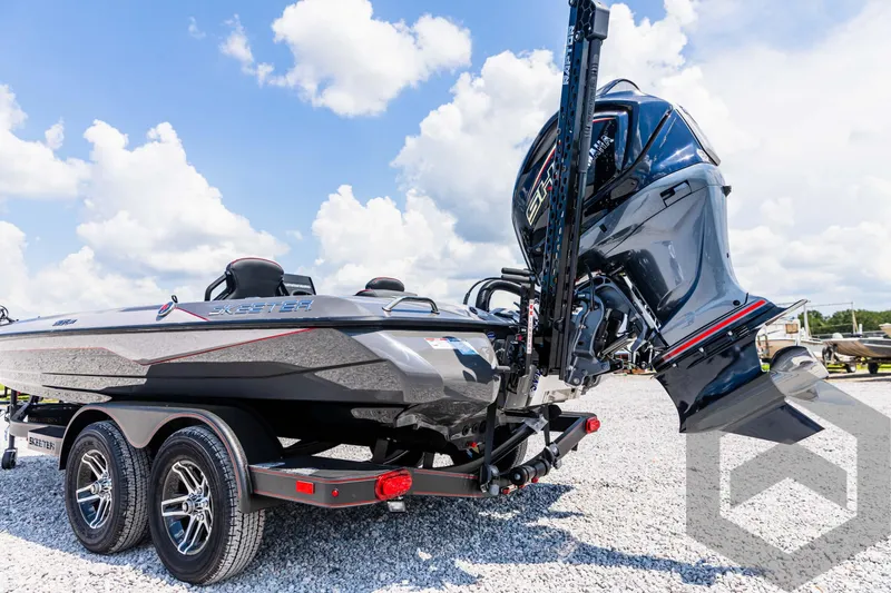 Slide: The Image of 2025 Skeeter ZXR 21 boat on trailer, featuring powerful outboard motor under a clear sky. - 18