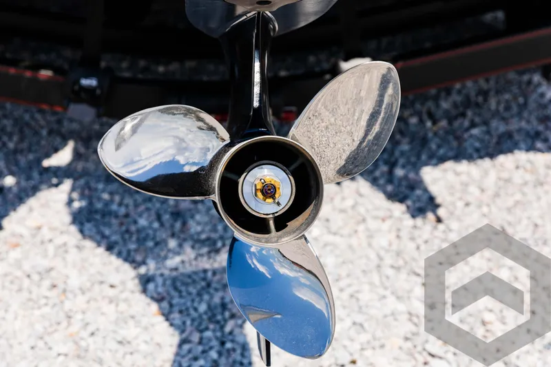 Slide: The Image of Skeeter ZXR 21 boat propeller, 2025 model, on gravel background. - 21
