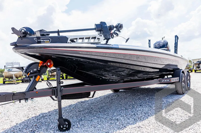 Slide: The Image of 2025 Skeeter ZXR 21 bass boat on trailer, sleek design, outdoor display. - 23