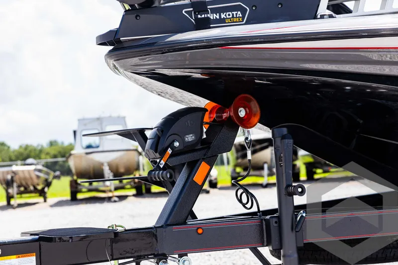 Slide: The Image of 2025 Skeeter ZXR 21 boat on trailer, featuring Minn Kota Ultrex motor. - 24
