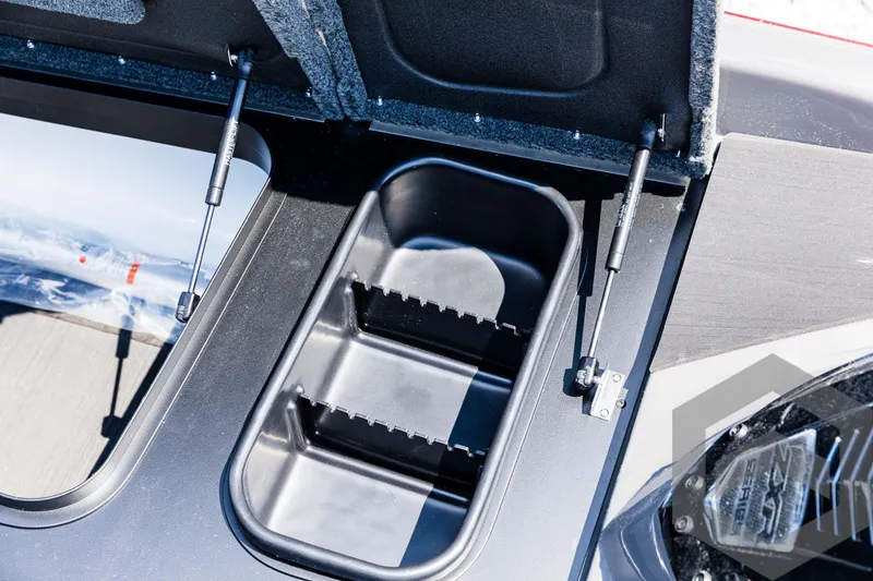 Slide: The Image of 2025 Skeeter ZXR 21 boat storage compartment with hydraulic lift supports. - 32