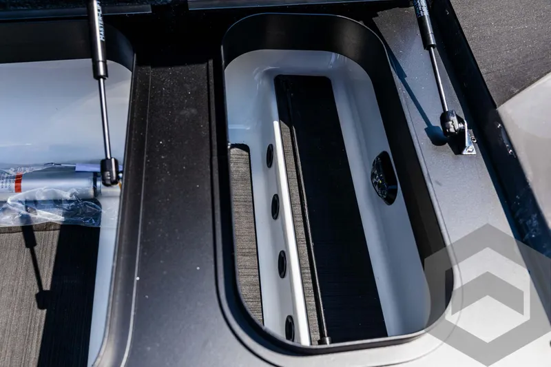 Slide: The Image of Skeeter ZXR 21 boat storage compartment, 2025 model, with hydraulic lift supports. - 33