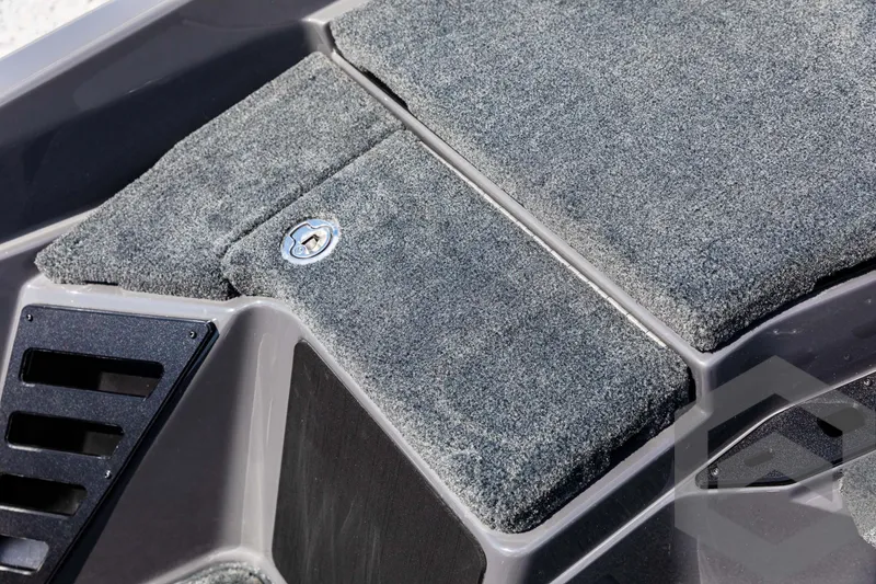 Slide: The Image of Skeeter ZXR 21 boat interior, 2025 model, featuring carpeted storage compartment. - 41
