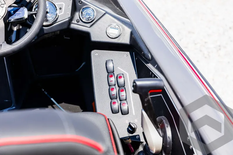 Slide: The Image of 2025 Skeeter ZXR 21 boat cockpit with control panel and steering wheel. - 49