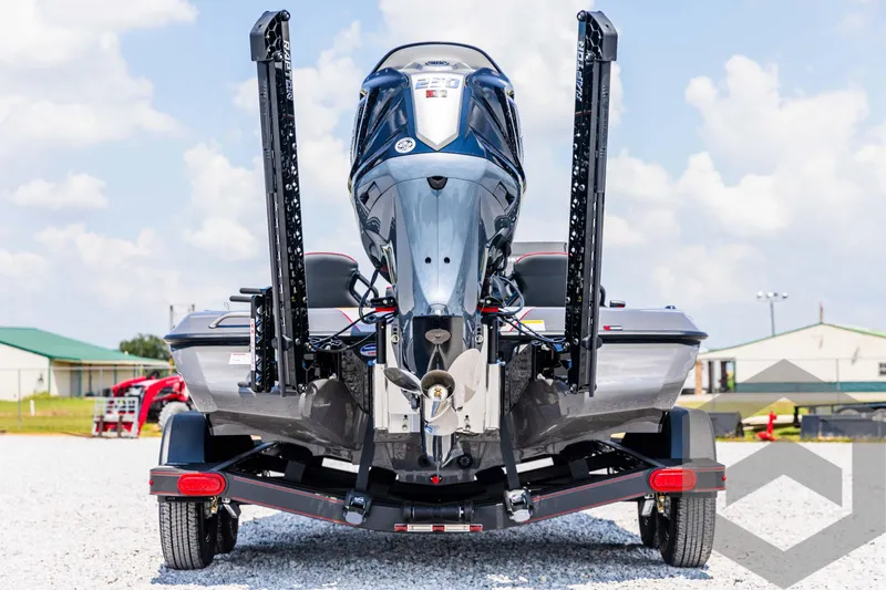 Slide: The Image of 2025 Skeeter ZXR 21 boat rear view with powerful engine and dual power poles. - 6
