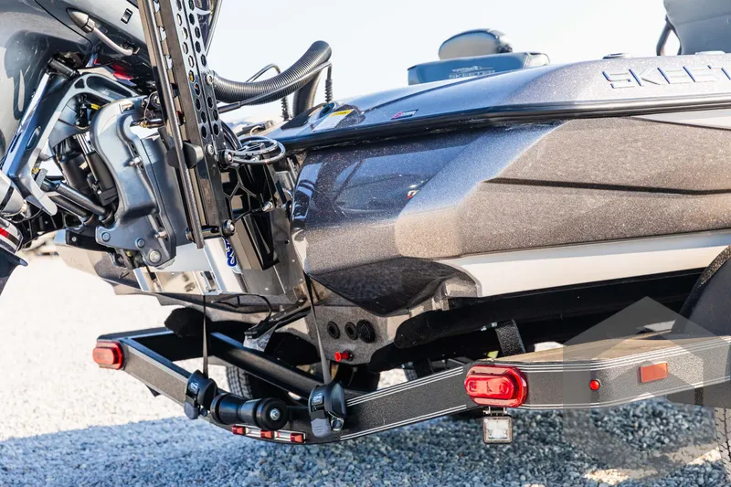 Slide: The Image of 2025 Skeeter ZXR 20 boat on trailer, detailed view of motor and hull. - 14