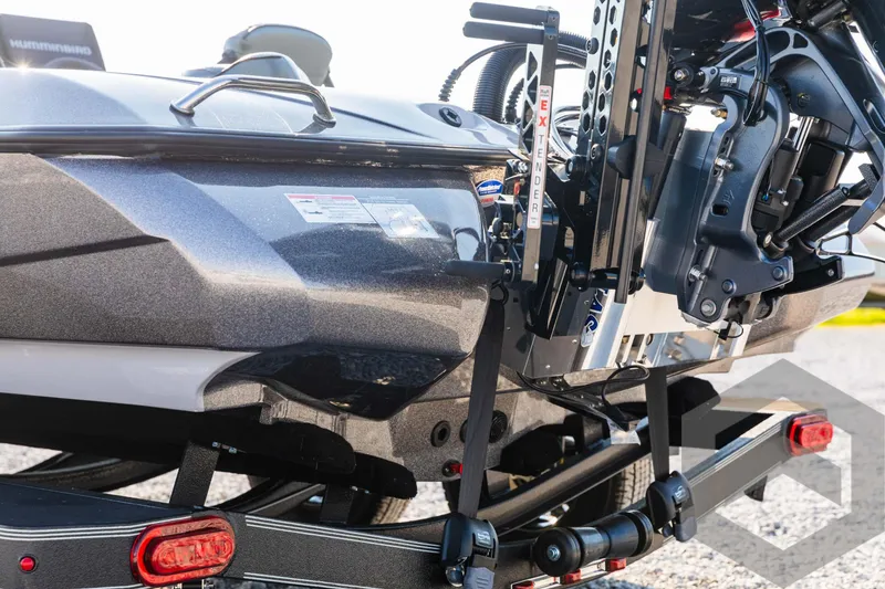 Slide: The Image of 2025 Skeeter ZXR 20 boat on trailer, detailed view of motor and hull. - 17