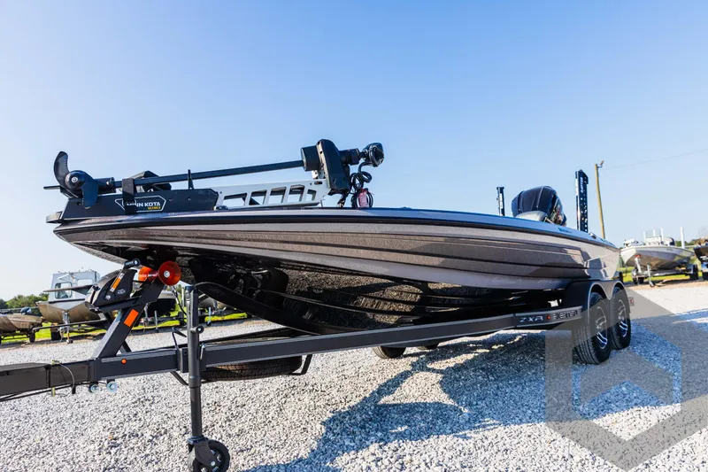 Slide: The Image of 2025 Skeeter ZXR 20 boat on trailer, displayed outdoors on gravel. - 22