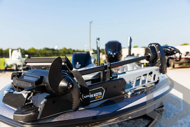 Slide: The Image of Skeeter ZXR 20 boat with Minn Kota motor, 2025 model, in a sunny outdoor setting. - 25