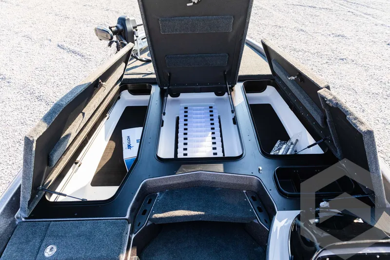 Slide: The Image of 2025 Skeeter ZXR 20 boat interior with open storage compartments and organized layout. - 29