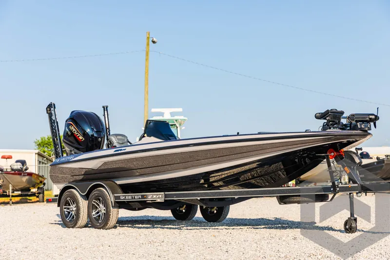 Slide: The Image of 2025 Skeeter ZXR 20 boat on trailer in outdoor setting. - 3