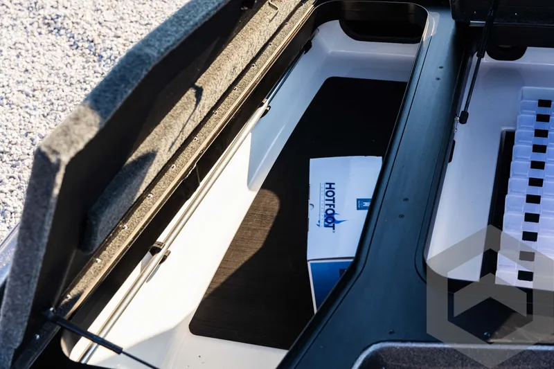 Slide: The Image of 2025 Skeeter ZXR 20 boat storage compartment with HotFoot pedal box. - 30