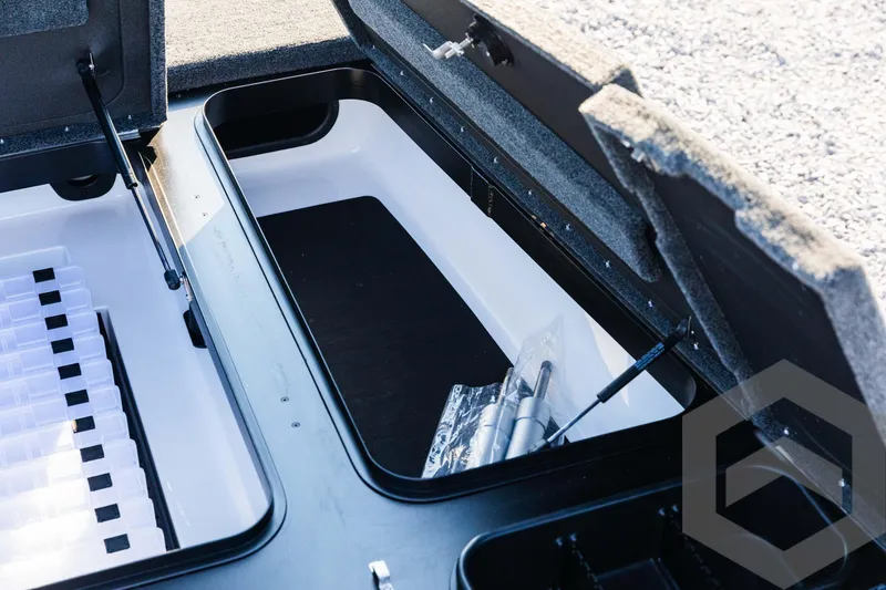 Slide: The Image of Open storage compartments in a 2025 Skeeter ZXR 20 boat. - 32