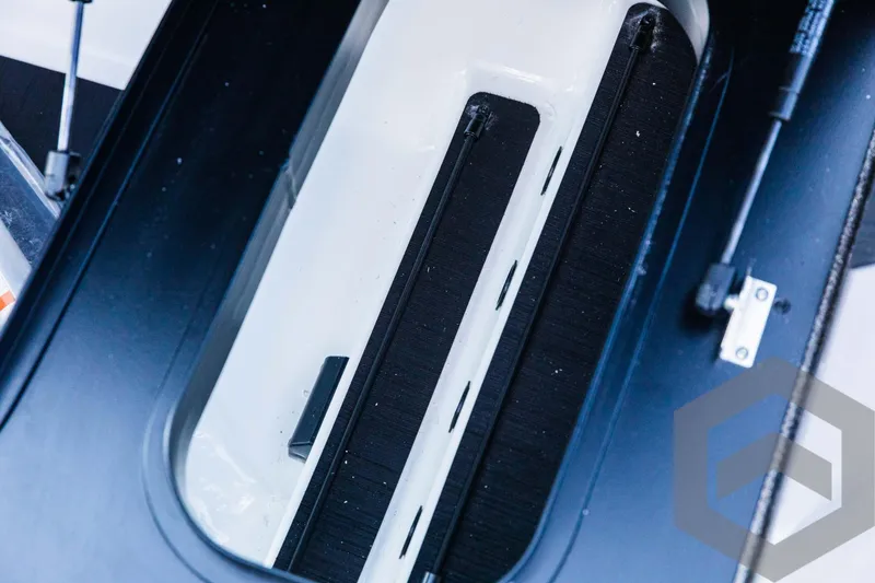 Slide: The Image of 2025 Skeeter ZXR 20 boat interior detail with sleek black and white design. - 34