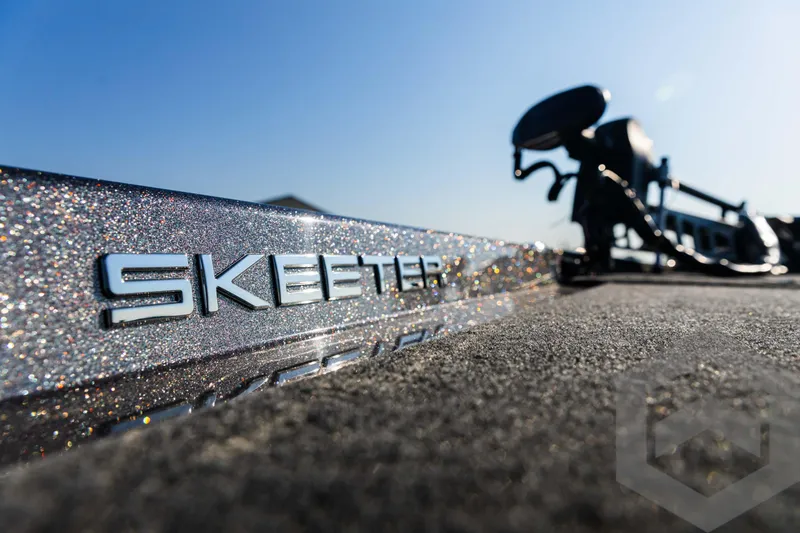 Slide: The Image of Close-up of 2025 Skeeter ZXR 20 boat with sparkling finish under clear blue sky. - 40