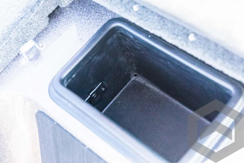 Slide: The Image of Storage compartment in 2025 Skeeter ZXR 20 boat, black interior. - 42