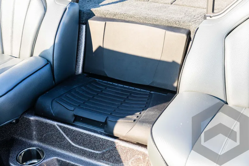 Slide: The Image of 2025 Skeeter ZXR 20 boat interior seating with cup holder and storage area. - 48