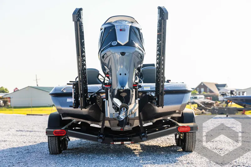 Slide: The Image of 2025 Skeeter ZXR 20 boat, rear view, parked on gravel lot. - 6