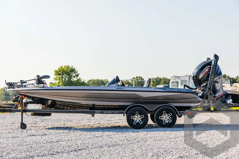 Slide: The Image of 2025 Skeeter ZXR 20 boat on trailer, side view, outdoors. - 8