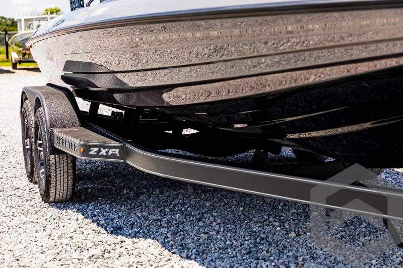 Slide: The Image of 2025 Skeeter ZXR 20 boat on trailer, showcasing sleek design and durable construction. - 10