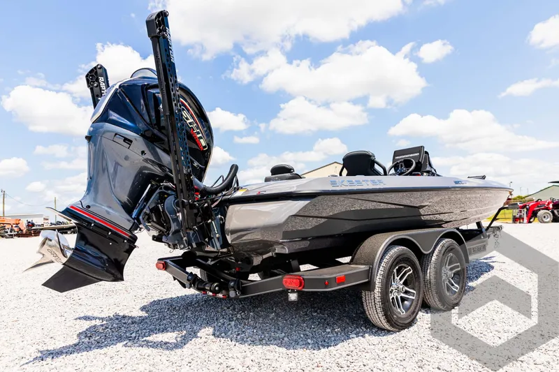 Slide: The Image of 2025 Skeeter ZXR 20 boat on trailer under blue sky. - 13