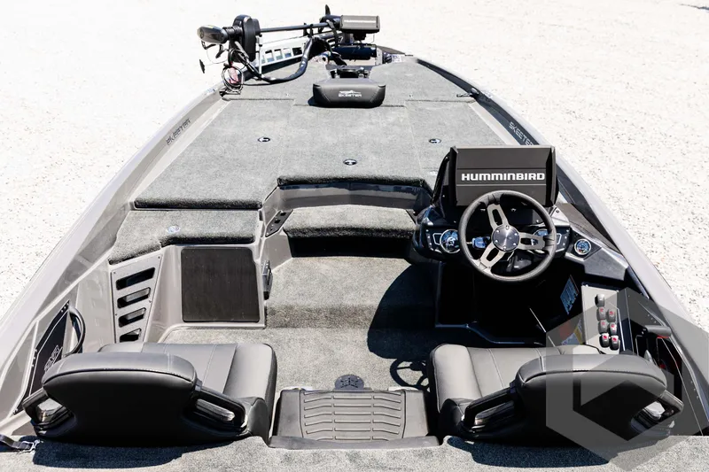 Slide: The Image of 2025 Skeeter ZXR 20 boat interior with steering wheel and seating. - 28