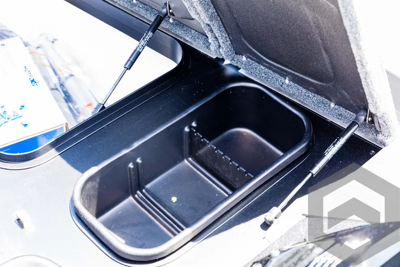 Slide: The Image of Skeeter ZXR 20 (2025) storage compartment with hydraulic lift supports. - 33