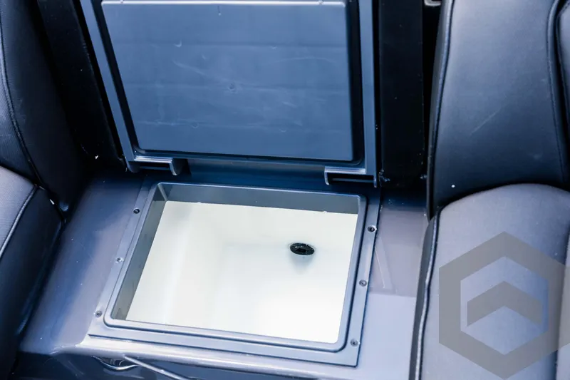 Slide: The Image of Skeeter ZXR 20 (2025) boat storage compartment, open and empty. - 45