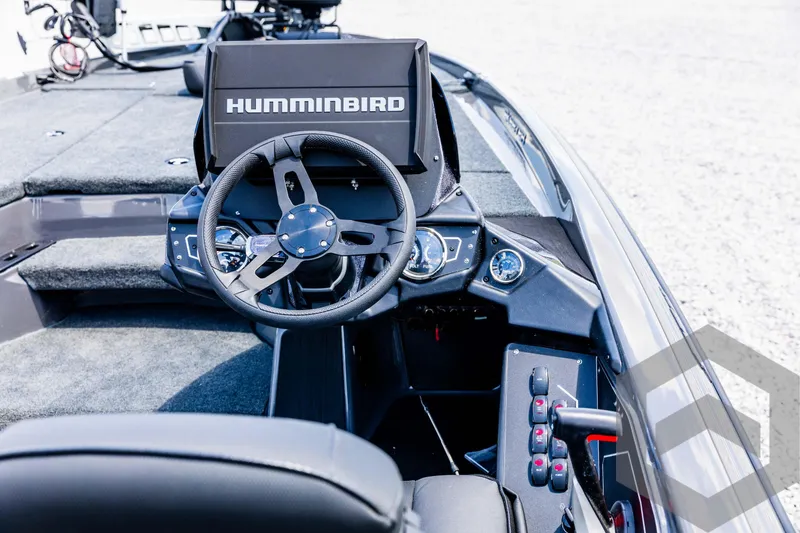 Slide: The Image of 2025 Skeeter ZXR 20 boat cockpit with Humminbird electronics and modern steering wheel. - 48
