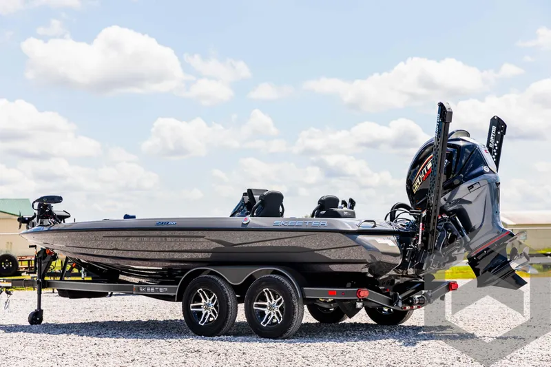 Slide: The Image of 2025 Skeeter ZXR 20 boat on trailer under a cloudy sky. - 7