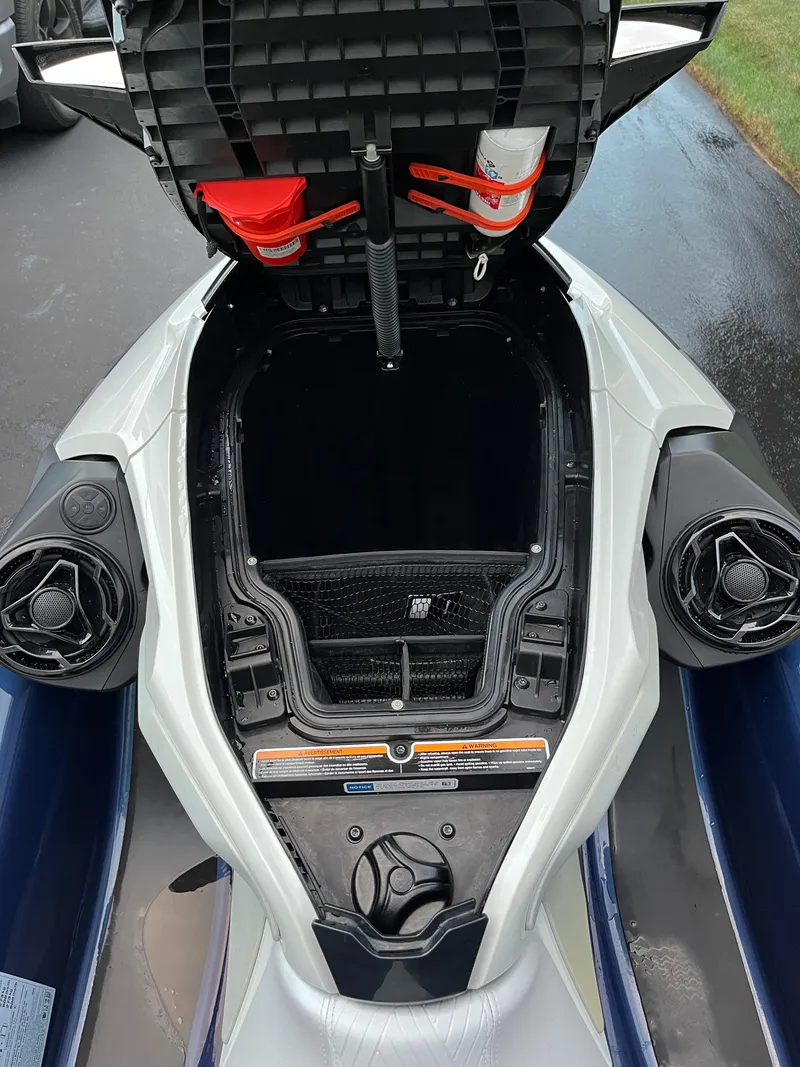 Slide: The Image of 2023 Sea-Doo GTX 300 Limited storage compartment open, showcasing interior features. - 10