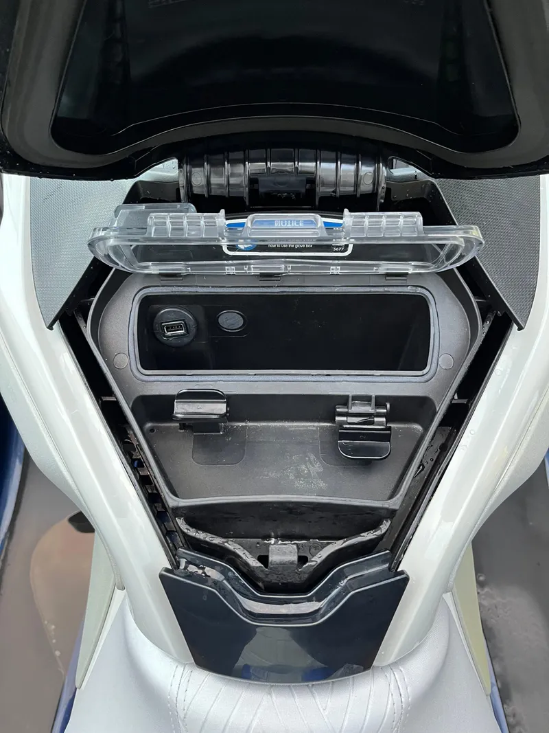 Slide: The Image of 2023 Sea-Doo GTX 300 Limited storage compartment with USB port and secure latch. - 11