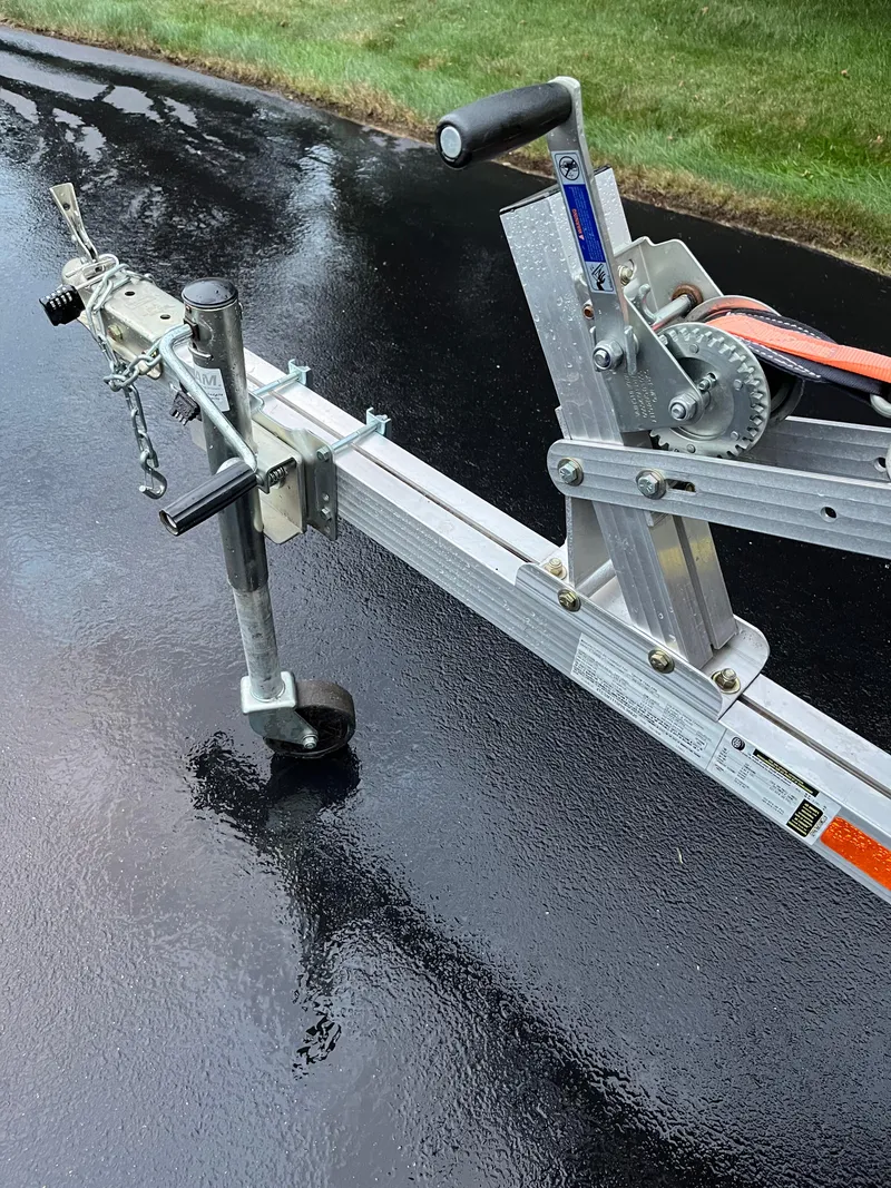 Slide: The Image of Trailer hitch and winch for 2023 Sea-Doo GTX 300 Limited on wet pavement. - 13