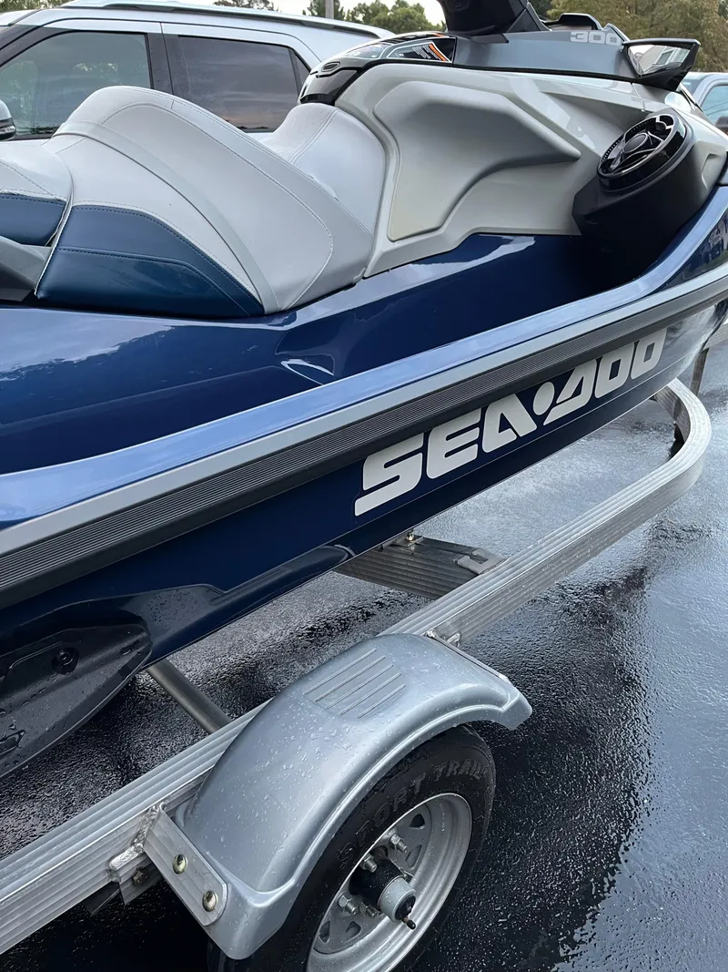 Slide: The Image of 2023 Sea-Doo GTX 300 Limited on trailer, blue and gray design. - 2