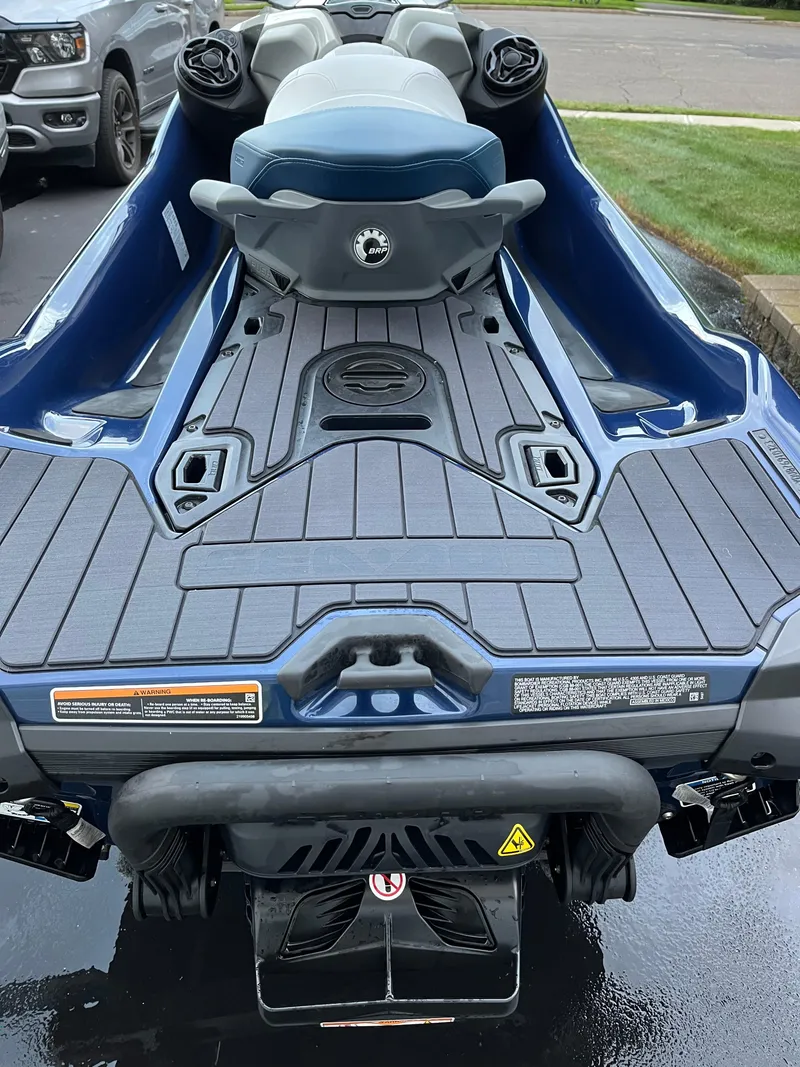 Slide: The Image of 2023 Sea-Doo GTX 300 Limited, rear view, blue and gray design, parked on pavement. - 4