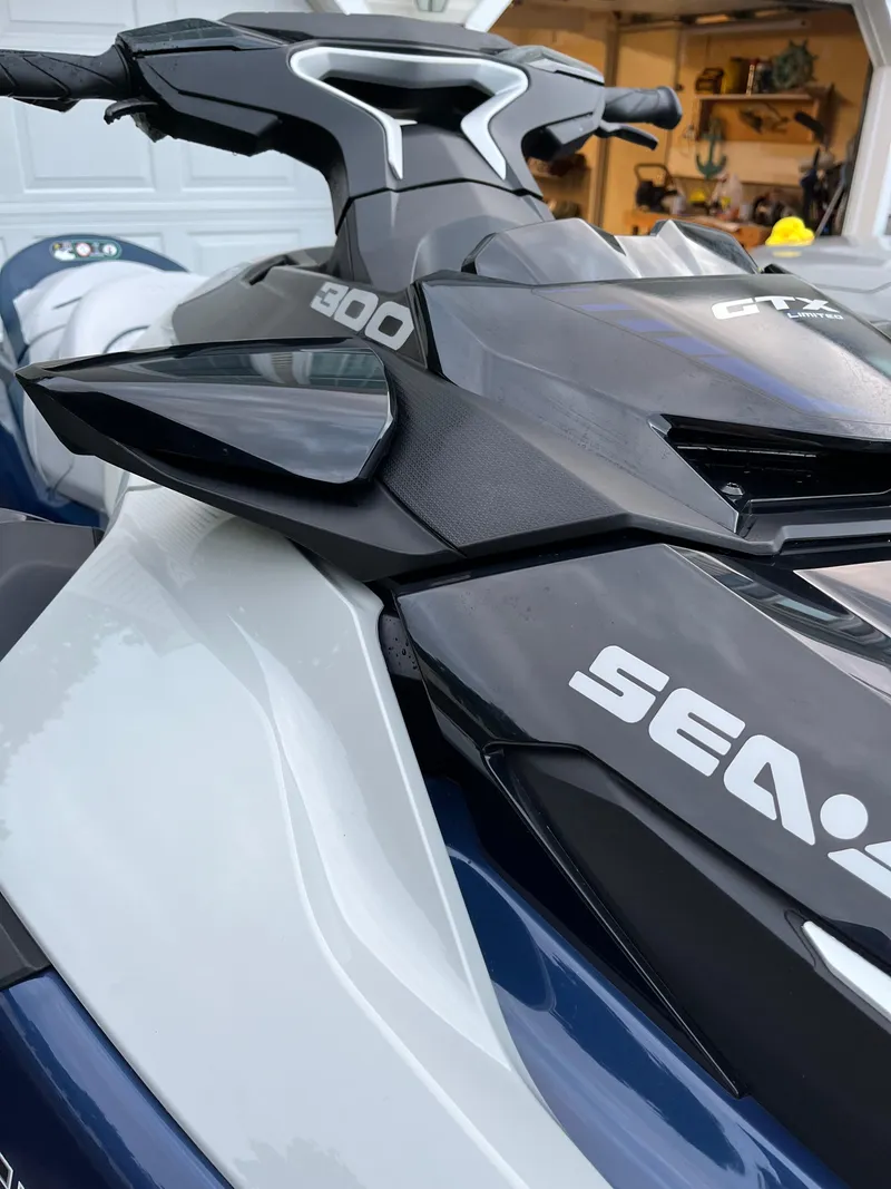 Slide: The Image of 2023 Sea-Doo GTX 300 Limited jet ski, close-up of handlebars and branding. - 7