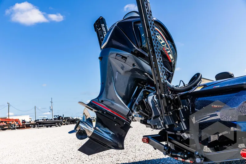 Slide: The Image of 2025 Skeeter ZXR 21 boat engine, sleek design, outdoor setting, clear blue sky. - 15