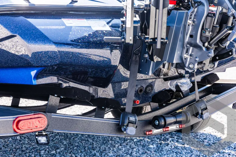 Slide: The Image of 2025 Skeeter ZXR 21 boat trailer detail with engine and frame components. - 18