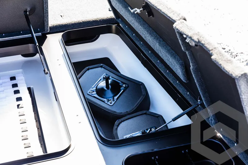 Slide: The Image of 2025 Skeeter ZXR 21 boat storage compartments with open lids. - 30