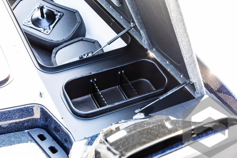 Slide: The Image of 2025 Skeeter ZXR 21 boat storage compartments with open lids. - 31