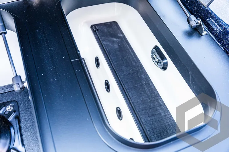 Slide: The Image of Skeeter ZXR 21 livewell, 2025 model, featuring a sleek, modern design. - 32