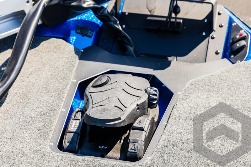 Slide: The Image of 2025 Skeeter ZXR 21 boat foot pedal control on carpeted deck. - 34